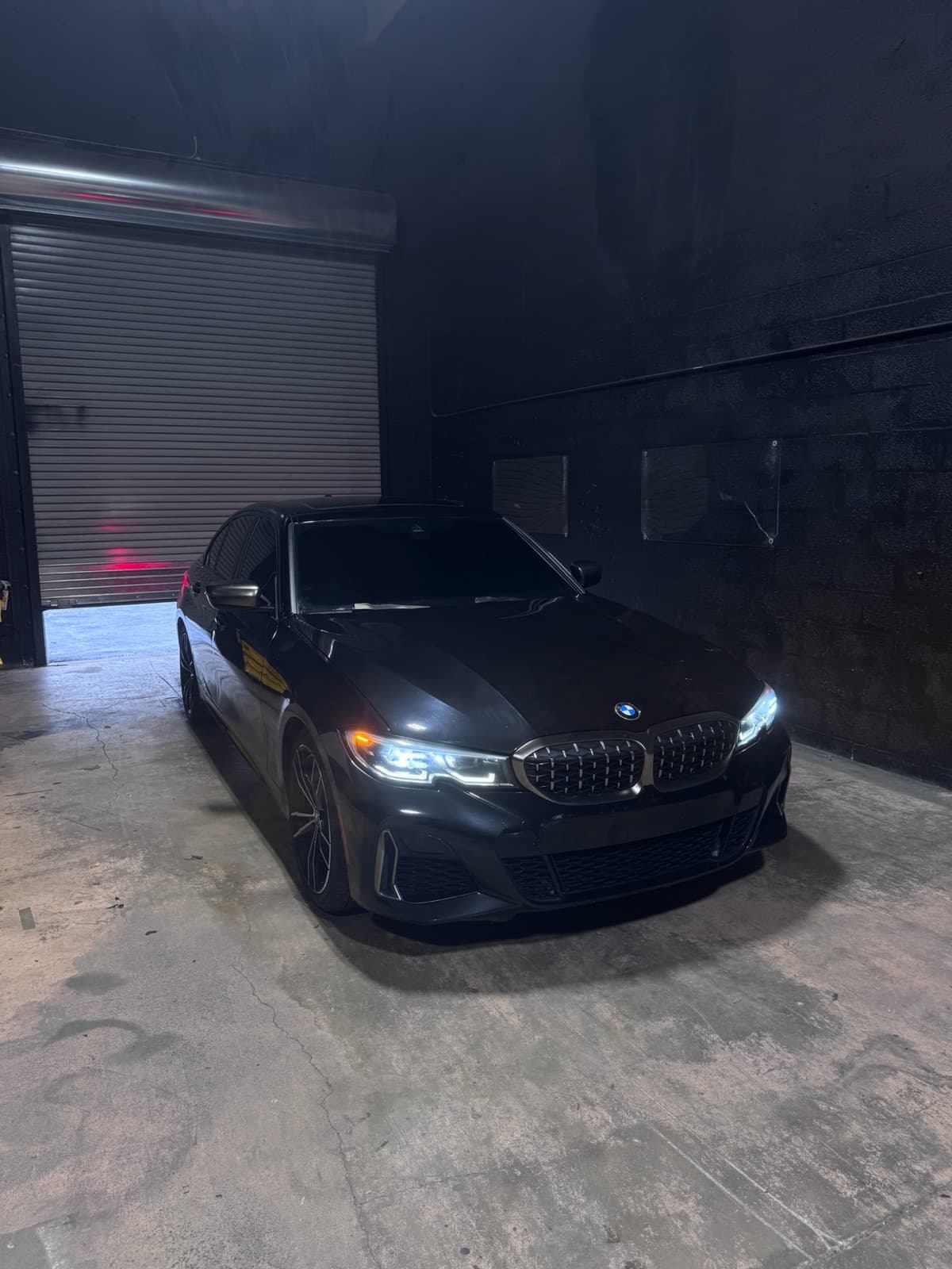 BMW M3 with ceramic window tint inside Dr. Tints Miami shop