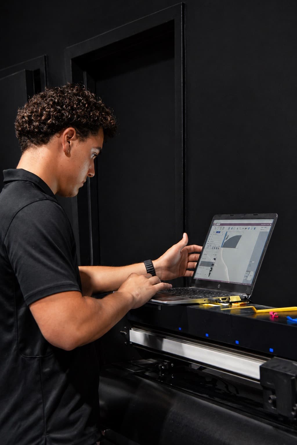 Dr. Tints Miami technician using plotter to pre-cut window film